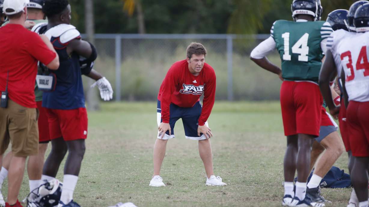 Youth is served: Weis Jr., 25, stands with Kiffin at FAU