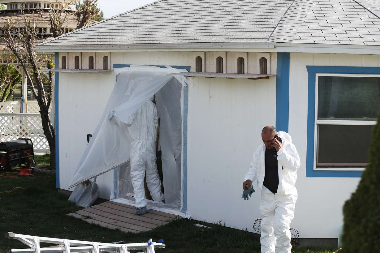Workers clean out and begin to tear down a pigeon loft in a residential backyard after a four-year legal battle in South Jordan Tuesday, March 31, 2015. (Photo: Jeffrey D. Allred, KSL)