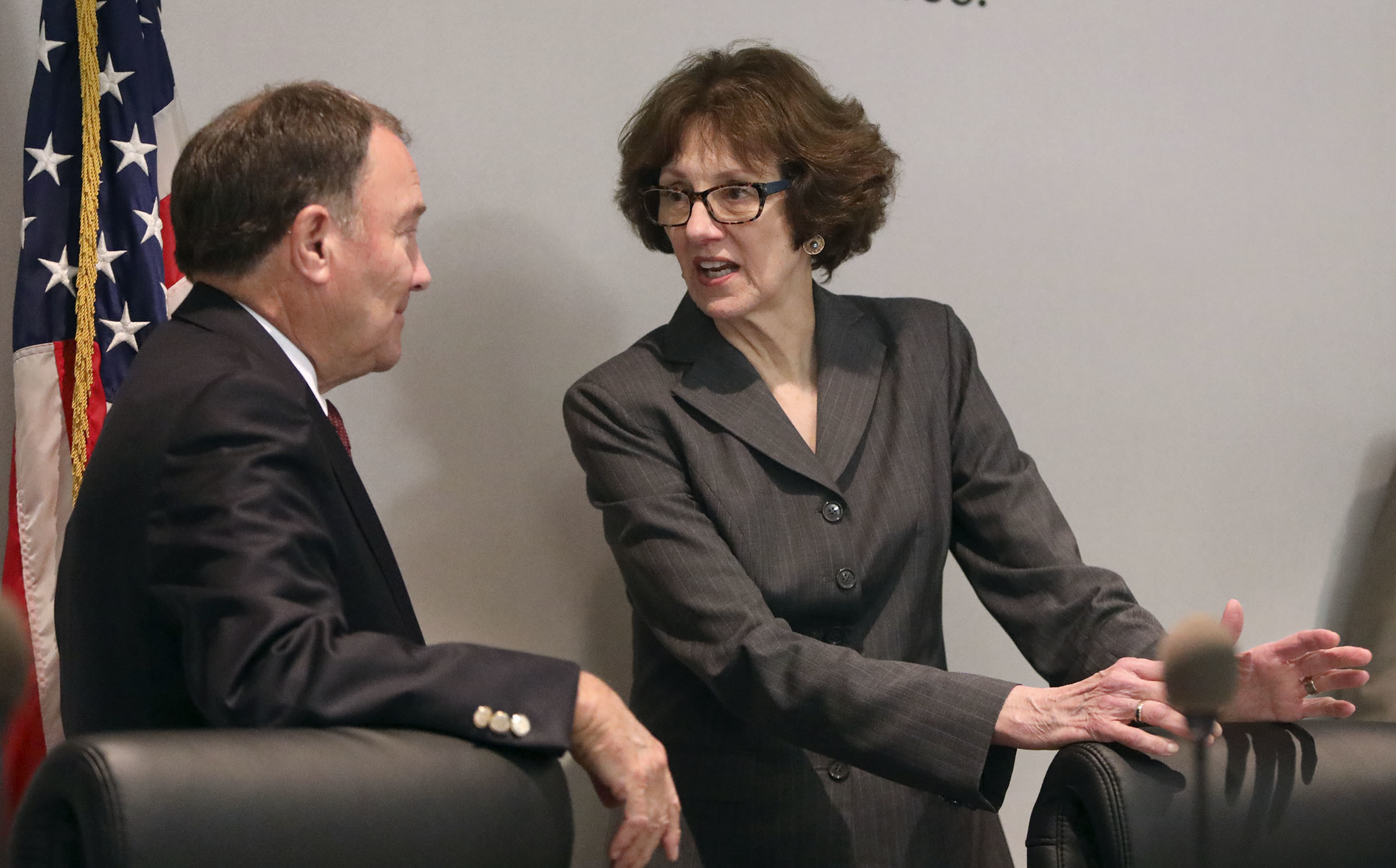 Utah Gov. Gary Herbert and Susan Combs, Interior Department's acting assistant secretary for policy, management and budget, talk before a roundtable discussion at the Ogden-Weber Chamber of Commerce in Ogden, Utah, on Tuesday, Aug. 28, 2018. (Kristin Murphy/The Deseret News via AP)