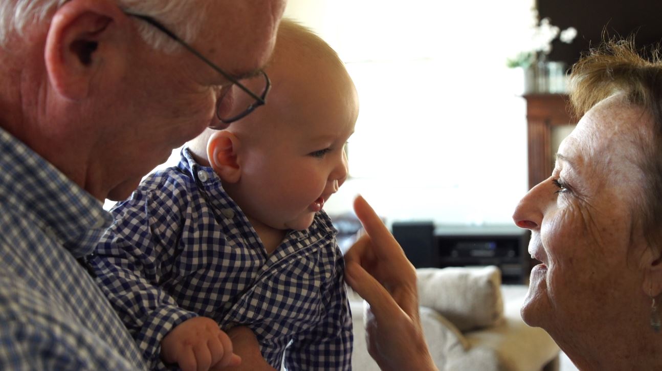 Mike and Jennifer Hamilton play with their grandson, Nolan. (Photo: KSL TV)