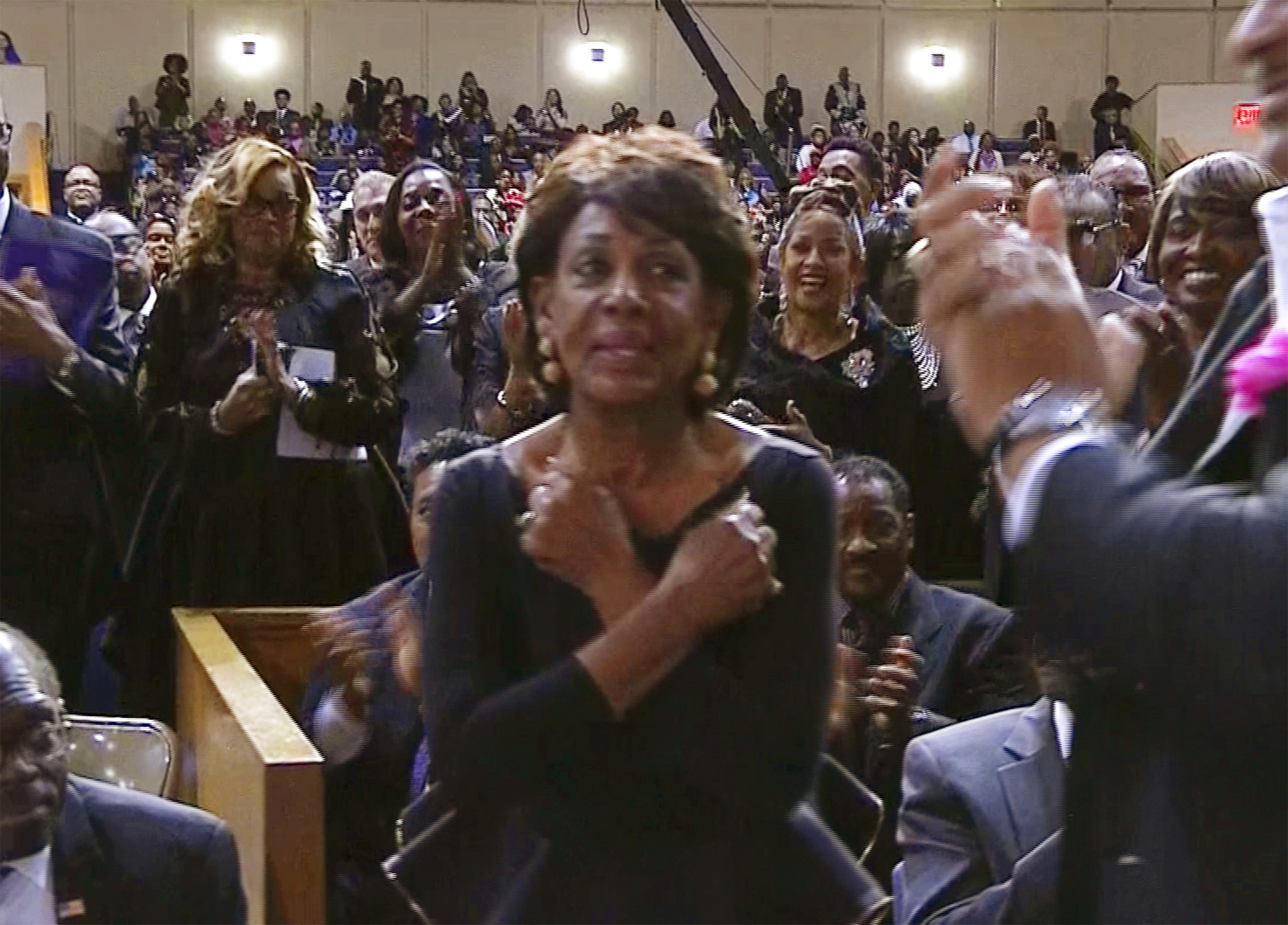 Rep. Maxine Waters gives Wakanda salute at Franklin funeral