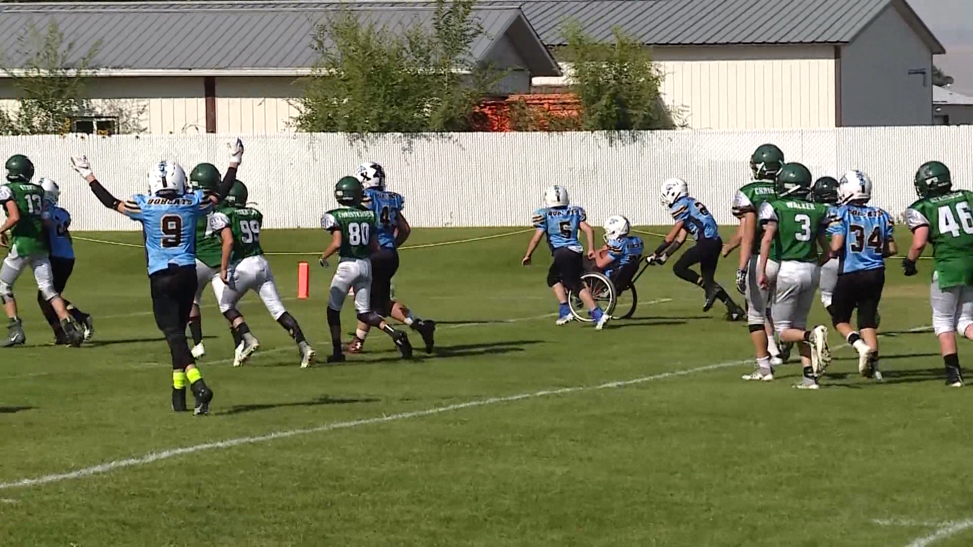 With the help of a teammate, Jake Larsen wheels in for a touchdown during the special 5th quarter of an eight-grade football game in Smithfield, Cache County, Saturday, Sept. 1, 2018. (Photo: Mike DeBernardo, KSL TV)