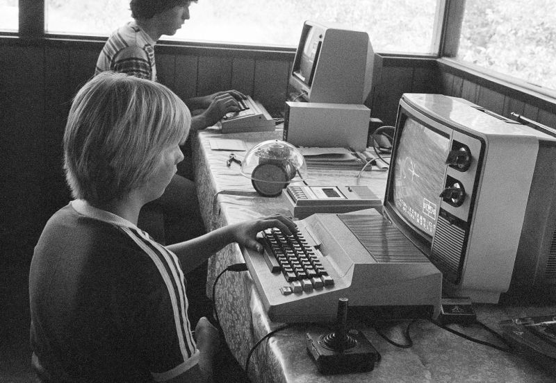 FILE- In this July 29, 1980, file photo, Greg Berman, 12, of Santa Barbara, Calif., sits at computer console at California Computer Camp near Santa Barbara. Today’s grandparents may have fond memories of the “good old days,” but history tells us that adults have worried about their kids’ fascination with new-fangled entertainment and technology since the days of dime novels, radio, the first comic books and rock n’ roll. (AP Photo/Hyman, File) - Associated Press