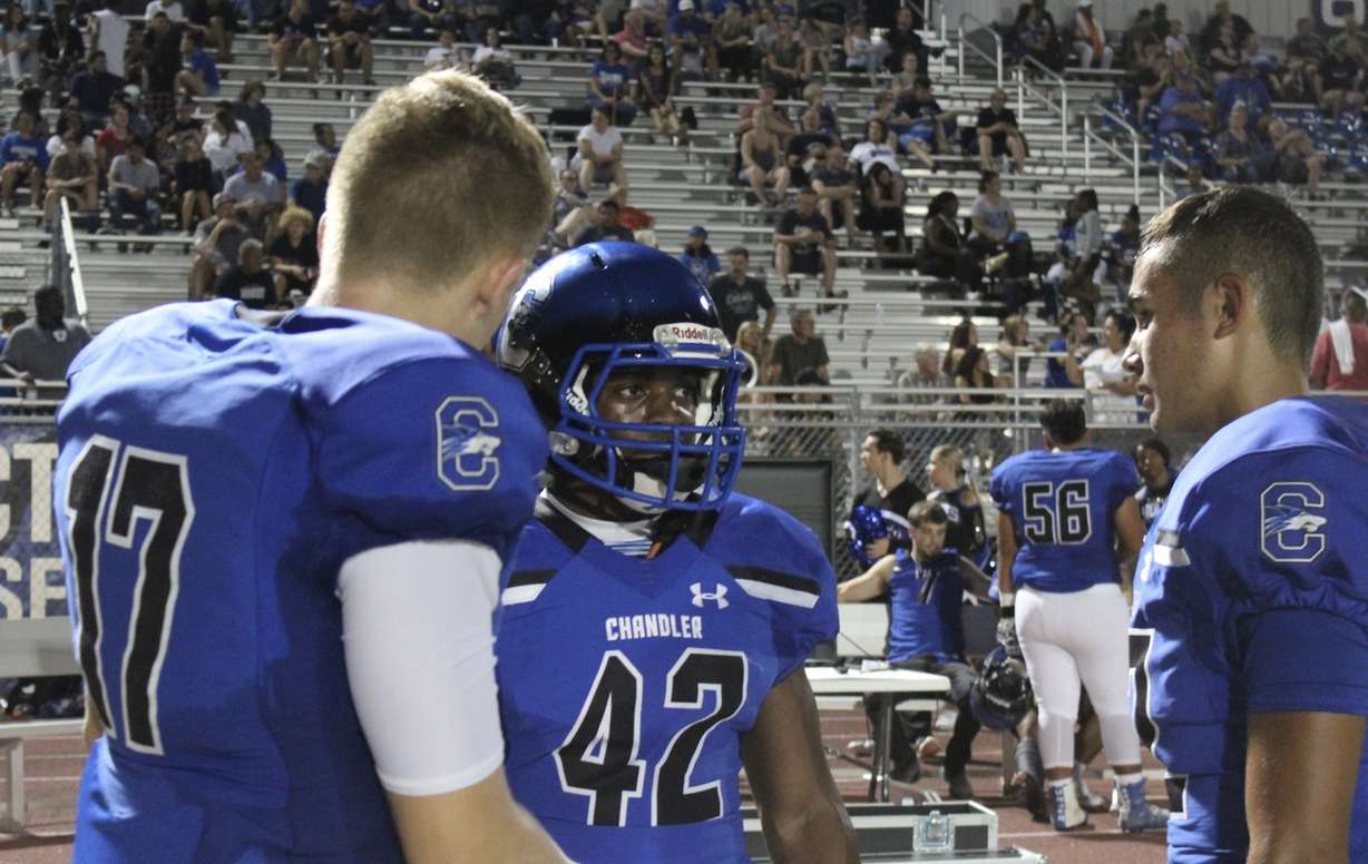 BYU quarterback commit Jacob Conover (17) talks to running back Timothy Boyd (42) during Chandler High's 62-0 win over visiting Mesa, Friday, Aug. 31, 2018 in Chandler, Arizona. (Photo: Sean Walker, KSL.com)