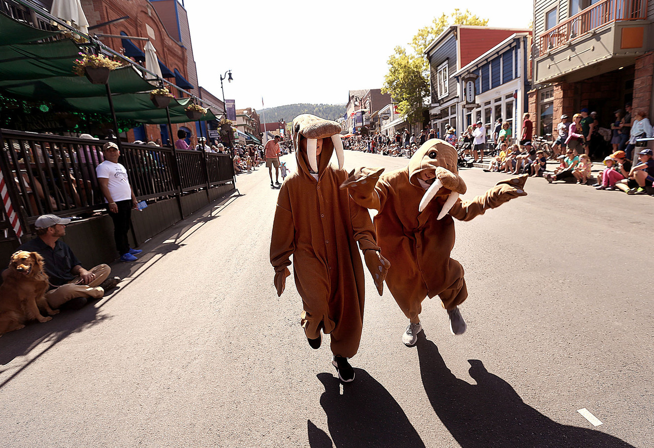 Sam and Whit Shepherd of Salt Lake City dance during the Miner’s Day Parade on Park City’s historic Main Street on Monday, Sept. 3, 2018. (Photo: Laura Seitz, KSL)