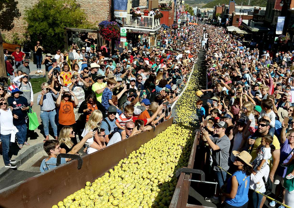 10,000 golf balls roll down Park City’s historic Main Street during the Running of the Balls on Monday, Sept. 3, 2018. The event is sponsored by the Park City Rotarians and benefits charity projects. (Photo: Laura Seitz, KSL)