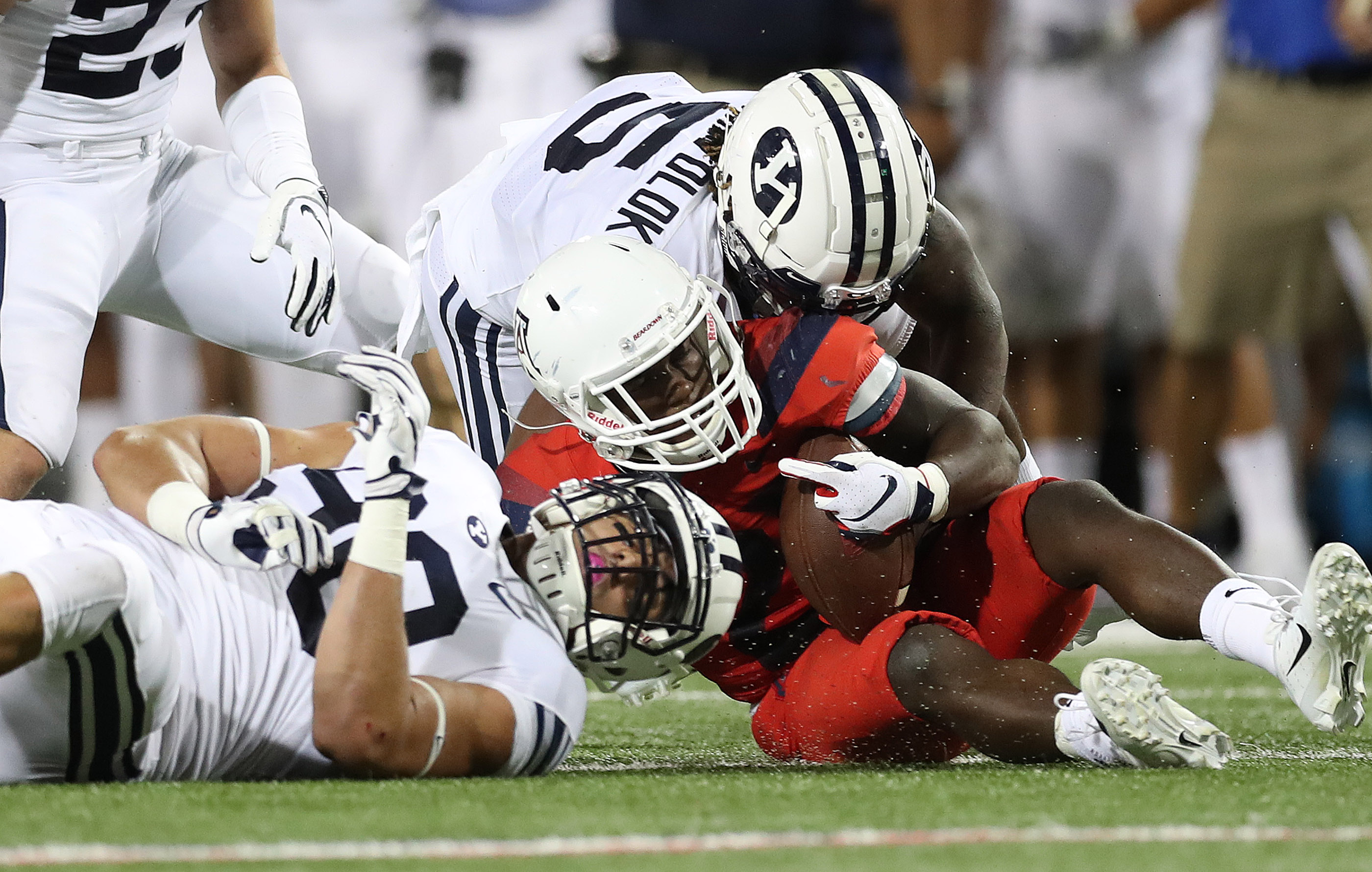 Brigham Young Cougars defensive lineman Corbin Kaufusi (90) tackles Arizona Wildcats running back J.J. Taylor (21) against the Arizona Wildcats in Tucson on Saturday, Sept. 1, 2018. (Photo: Jeffrey D. Allred, Deseret News)
