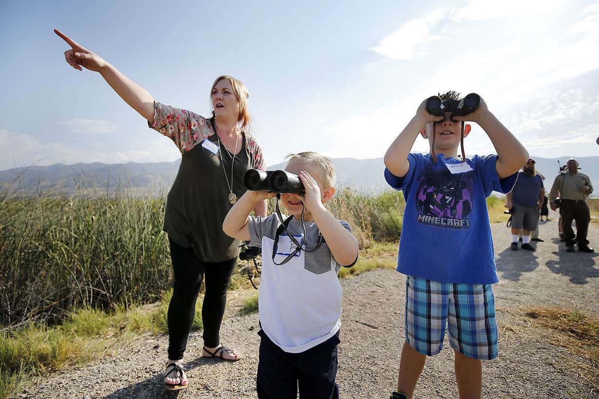 Crystal Fowlks and her sons, Bridger and Wyatt, look at birds as the Eccles Wildlife Education Center opens in Farmington on Wednesday, Sept. 5, 2018. (Photo: Ravell Call, KSL)