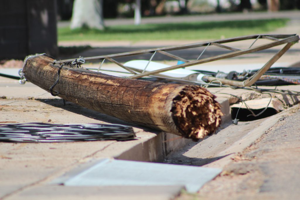 Student driver’s semitruck snags low utility lines, damages homes