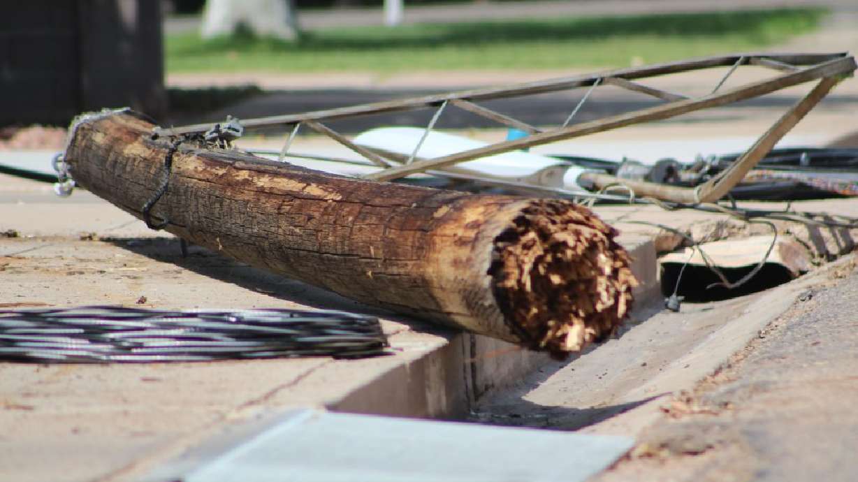 Student driver’s semitruck snags low utility lines, damages homes