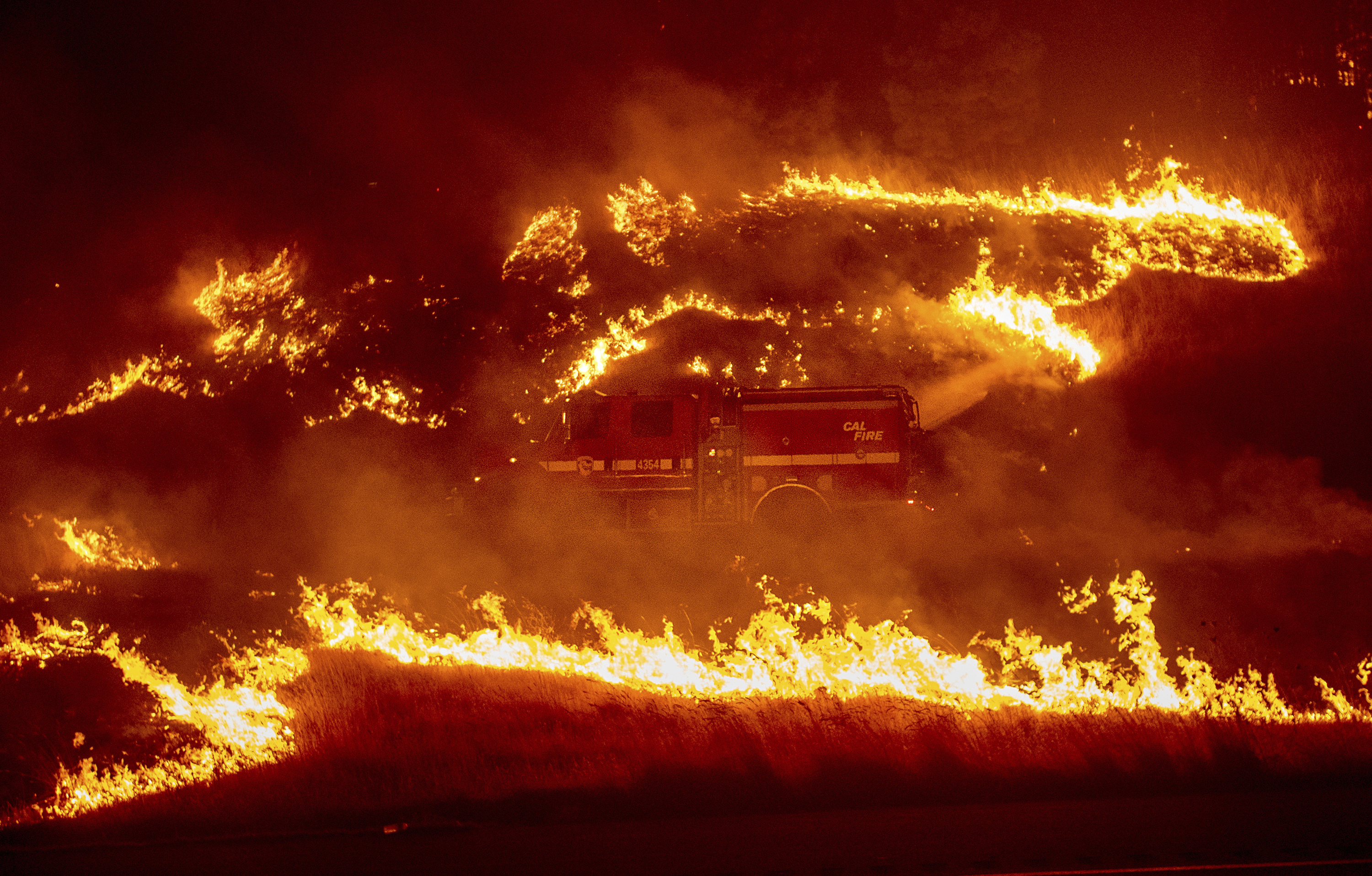 The Latest: California highway closed by fire for 3rd day