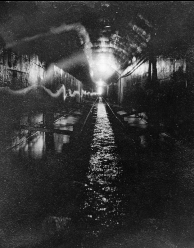 A the tunnel looking toward portal 1200 feet away near Strawberry Reservoir. The tunnel was a part of the Strawberry Valley Project, which was the state's first reclamation project. (Photo: Utah State History).