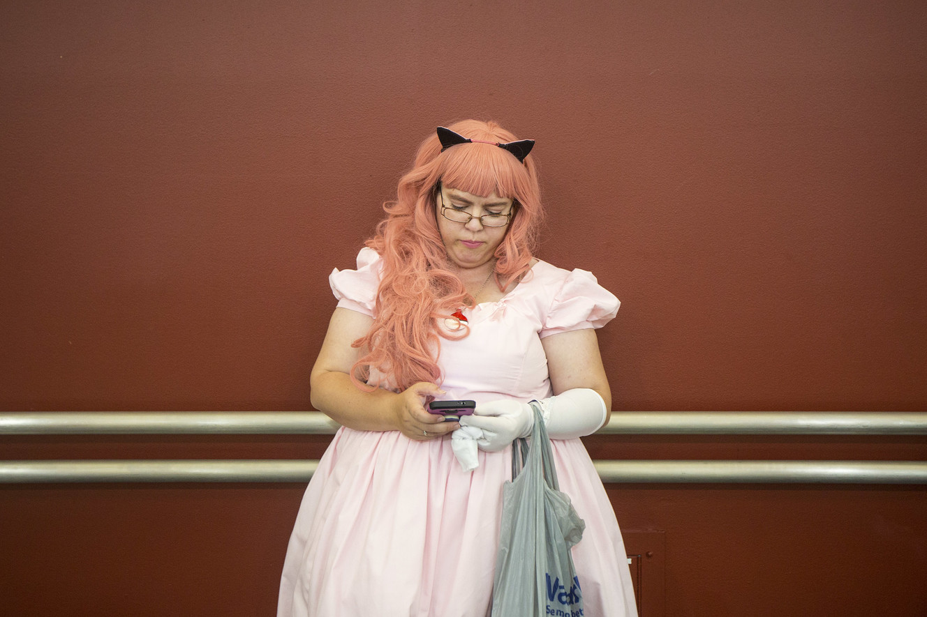Lara Blunt, dressed as Jigglypuff, takes a look at her phone while attending FanX Salt Lake Comic Convention at the Salt Palace Convention Center in Salt Lake City on Saturday, Sept. 8, 2018. (Photo: Qiling Wang, KSL)