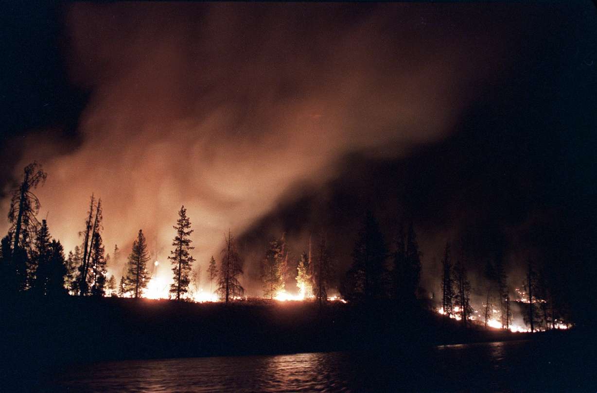 A forest fire blazes out of control less than 2 miles from West Yellowstone in Yellowstone National Park, Mont., Friday, Sept. 2, 1988. This summer marks the 30th anniversary of a series of wildfires that burned 36 percent of the park. (Photo: Tannen Maury, Associated Press)