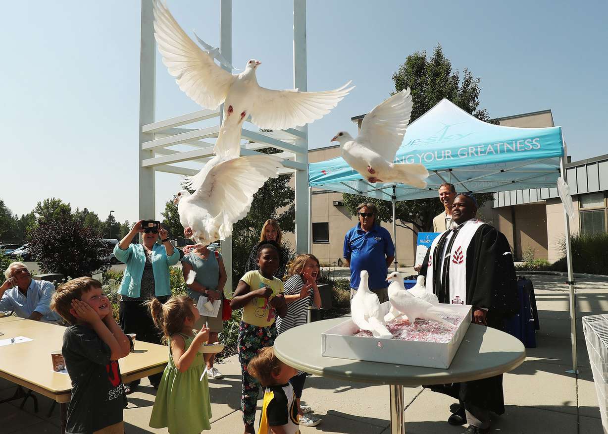 Doves are released to celebrate the completion of a 114-panel solar array project at Community of Grace Presbyterian Church in Sandy on Sunday, Sept. 9, 2018. (Photo: Jeffrey D. Allred, KSL)