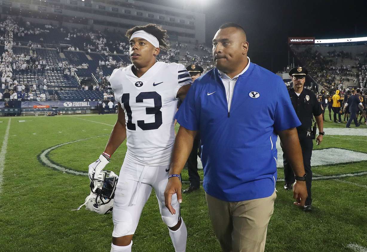 BYU head coach Kalani Sitaki leaves the field with BYU wide receiver Micah Simon (13) in Provo on Saturday, Sept. 8, 2018. BYU lost 31-28. (Photo: Jeffrey D. Allred, KSL)