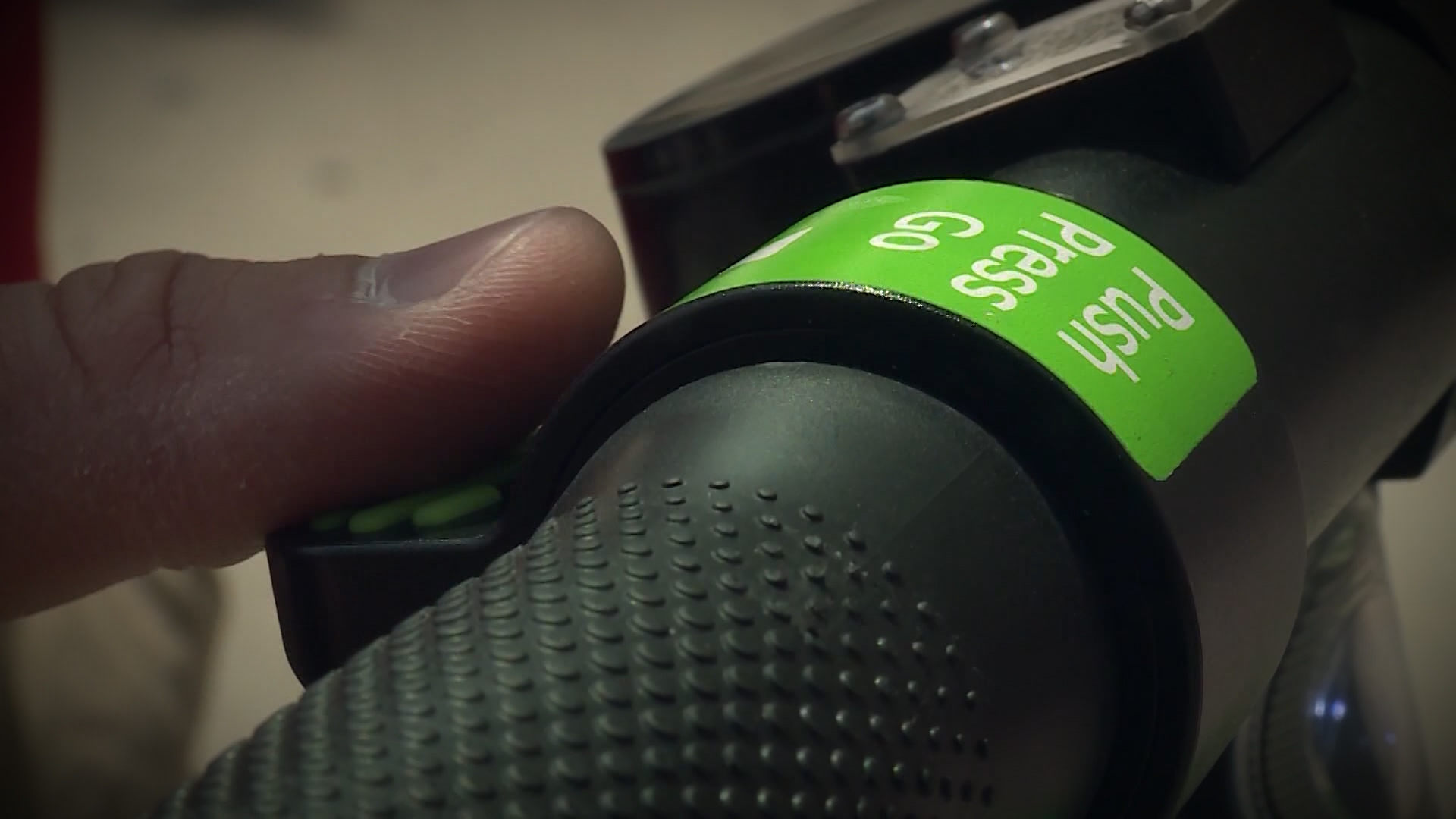 Both types of scooters have a go button on the handlebars. Photo: KSL TV