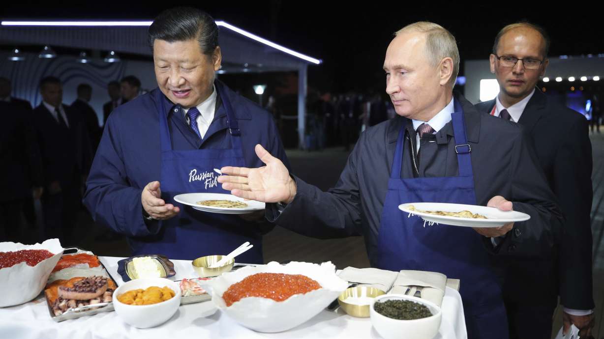 Putin treats China's leader to pancakes, vodka at forum