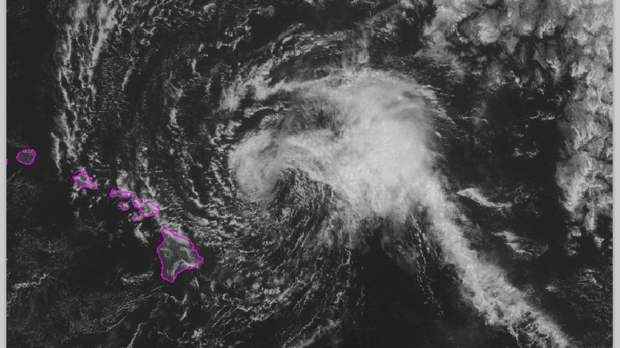 Tropical storm fades but still douses Hawaii with rain