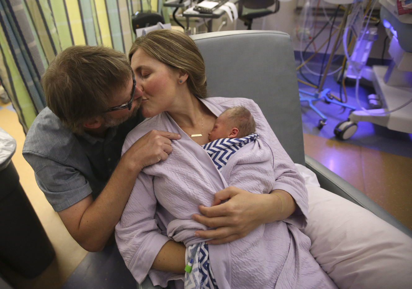 Chris Pearson kisses Jessica Pearson as she holds their 1-day-old son, CJ Pearson, in the Newborn Intensive Care Unit at University Hospital in Salt Lake City on Wednesday, Sept. 12, 2018. CJ was born six weeks early. (Photo: Kristin Murphy, KSL)