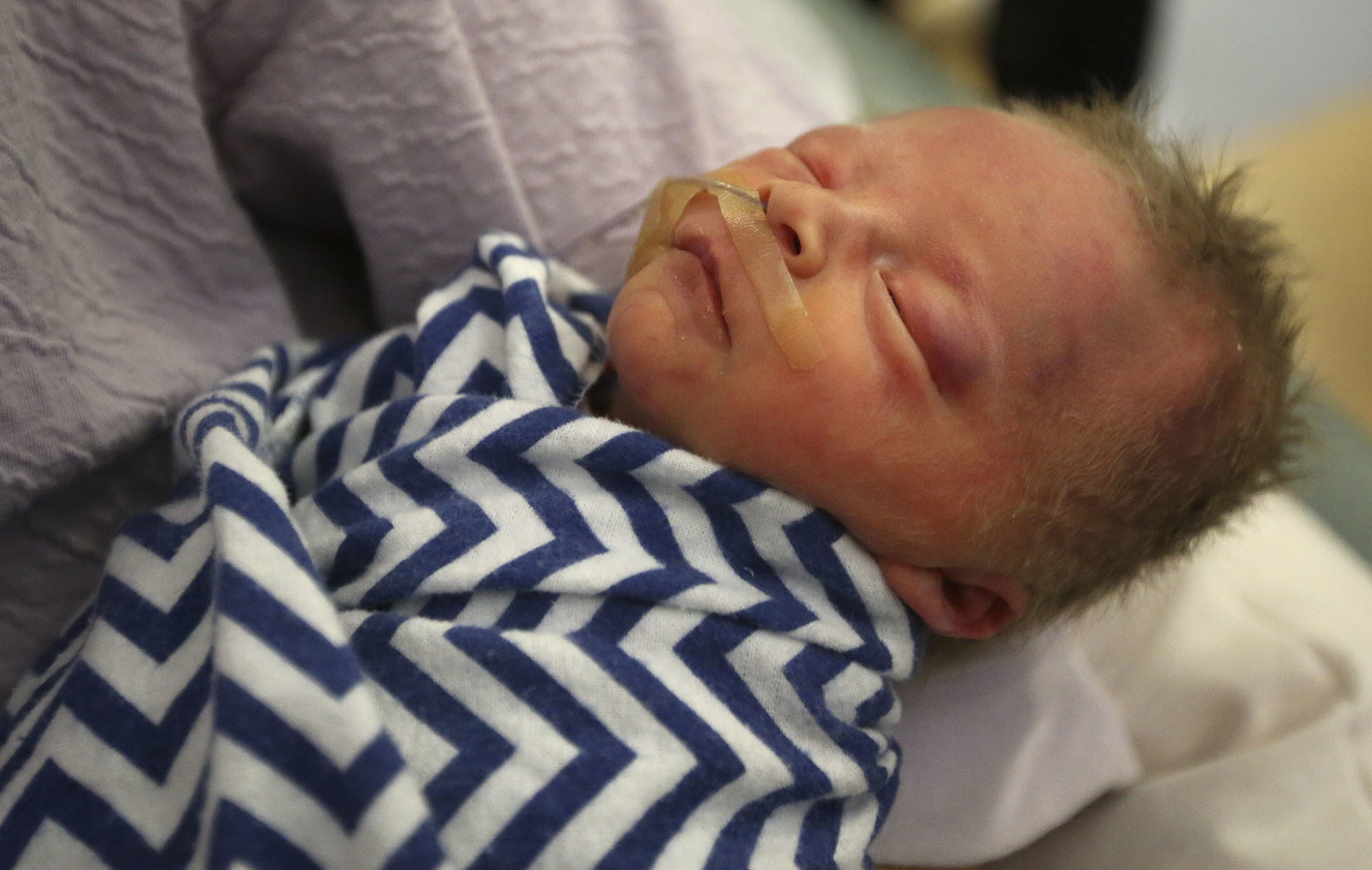 CJ Pearson, 1-day-old, sleeps in his mother's arms in the Newborn Intensive Care Unit at University Hospital in Salt Lake City on Wednesday, Sept. 12, 2018. CJ was born six weeks early. CJ was born six weeks early. (Photo: Kristin Murphy, KSL)