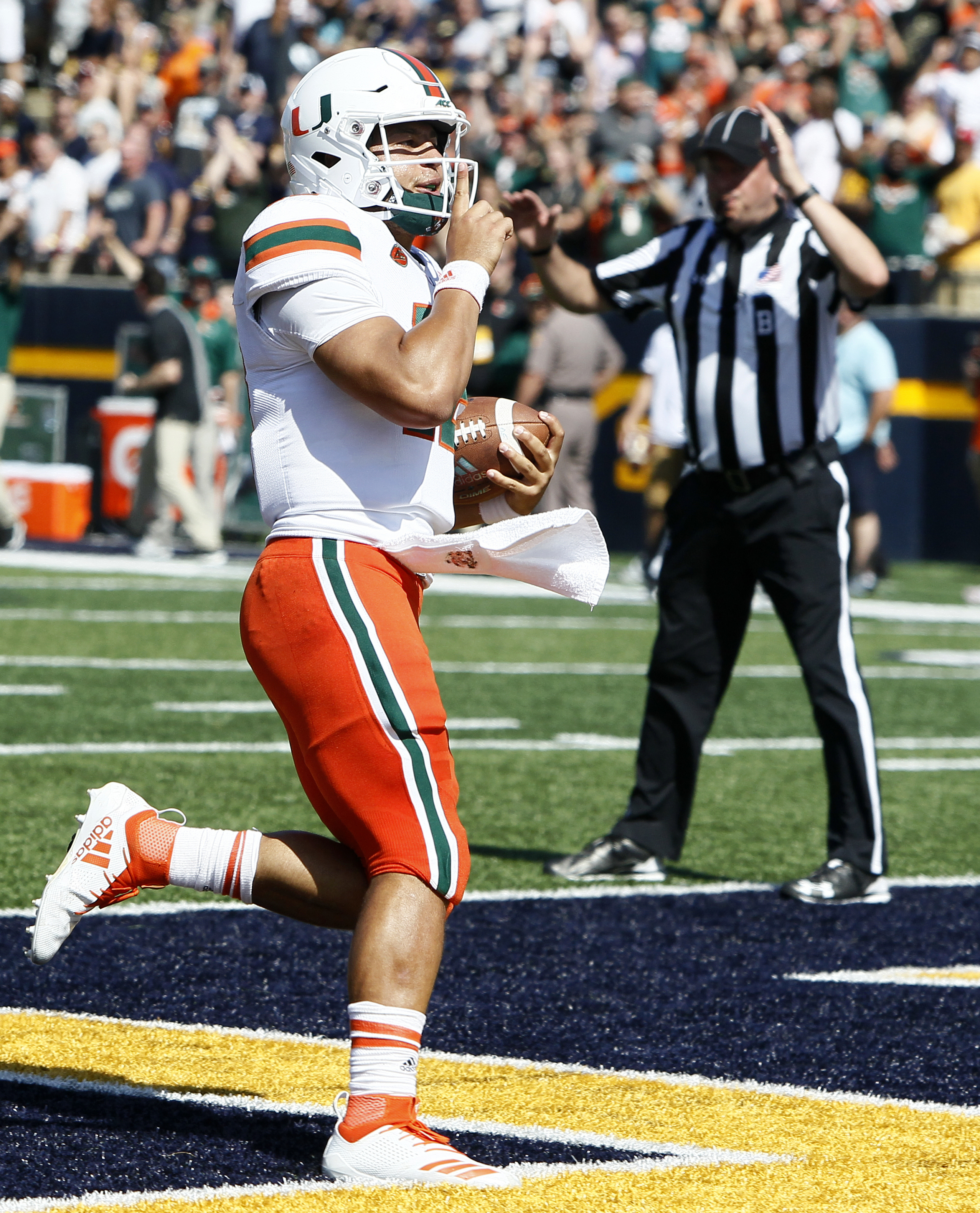 No. 21 Miami rolls past upset-minded Toledo 49-24