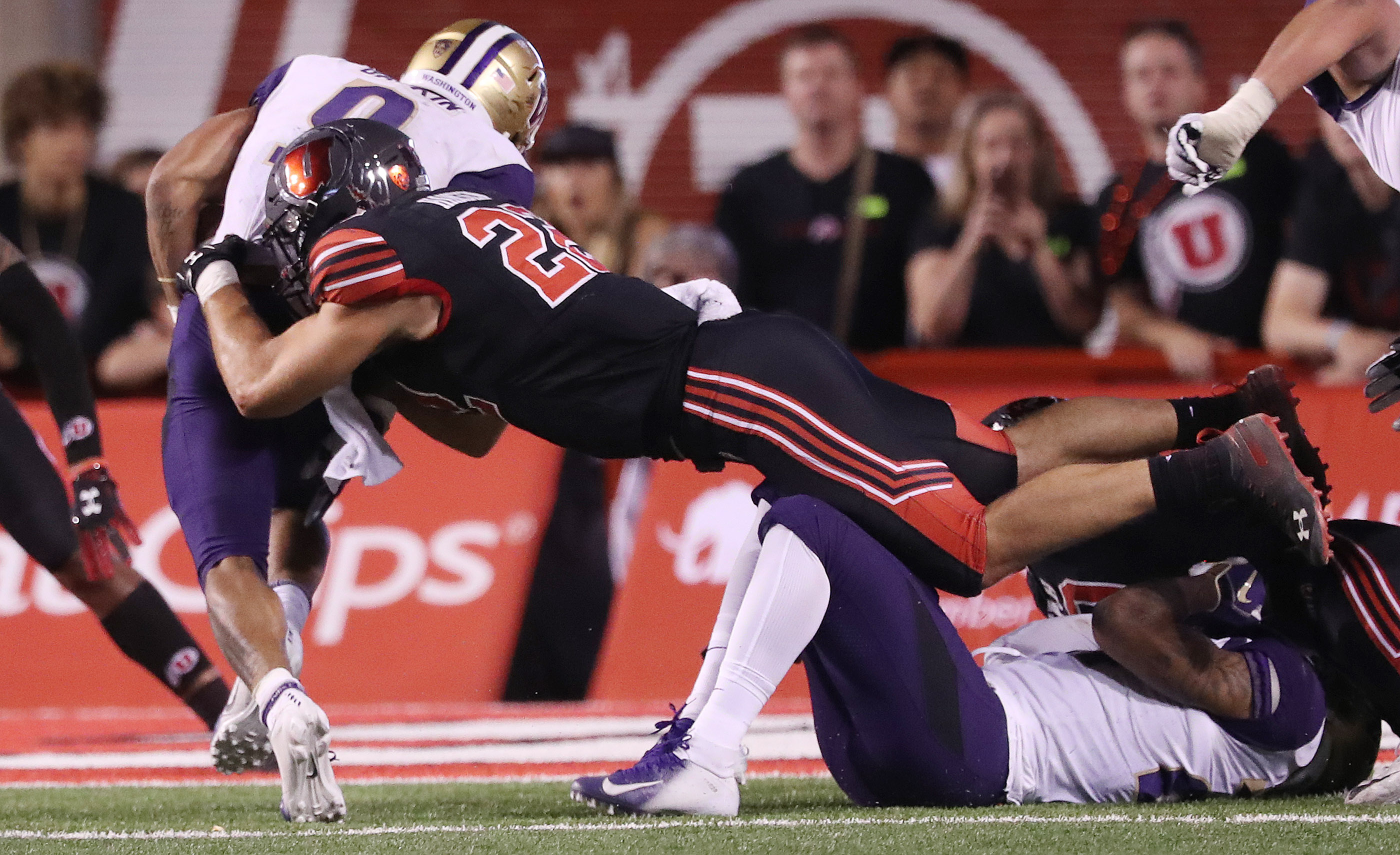 Utah Utes linebacker Chase Hansen (22) tackles Washington Huskies running back Myles Gaskin (9) in Salt Lake City on Saturday, Sept. 15, 2018. (Photo: Jeffrey D. Allred, KSL)