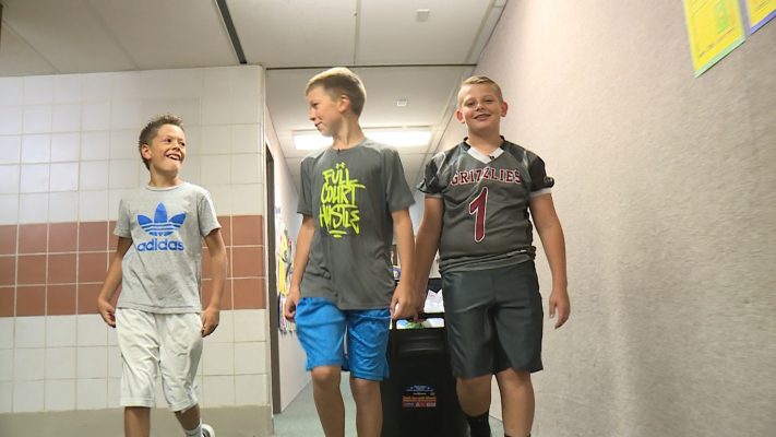 Sixth-graders Braylor Hoggan (left), Matthew Rudman (center), and Cade Draper (right) walk the halls on Tuesday, Sept. 11, 2018, to collect recyclable paper products from classrooms at Country View Elementary. (Photo: KSL TV)