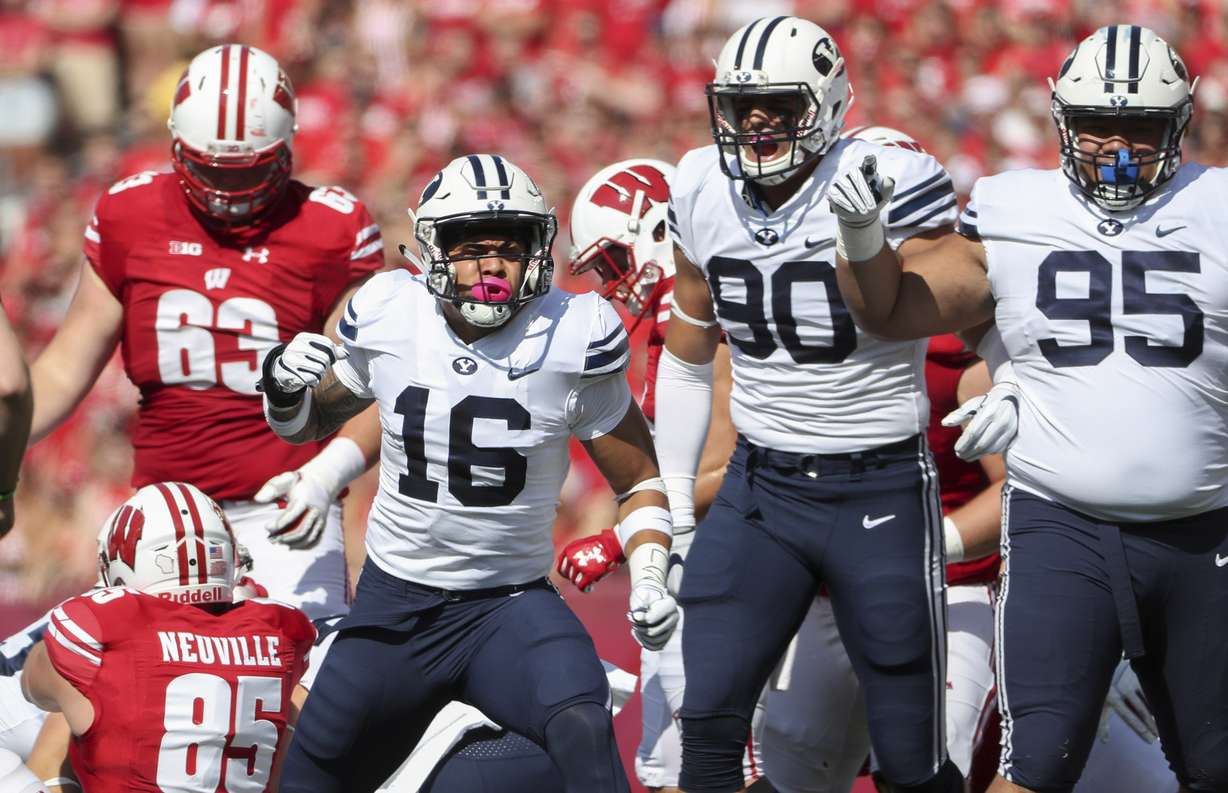 BYU linebacker Sione Takitaki (16) gets fired up with the rest of the BYU defense after making a tackle during the Wisconsin versus BYU football game at Camp Randall Stadium in Madison, WI in Salt Lake City on Saturday, Sept. 15, 2018. (Photo: Steve Griffin, Deseret News)