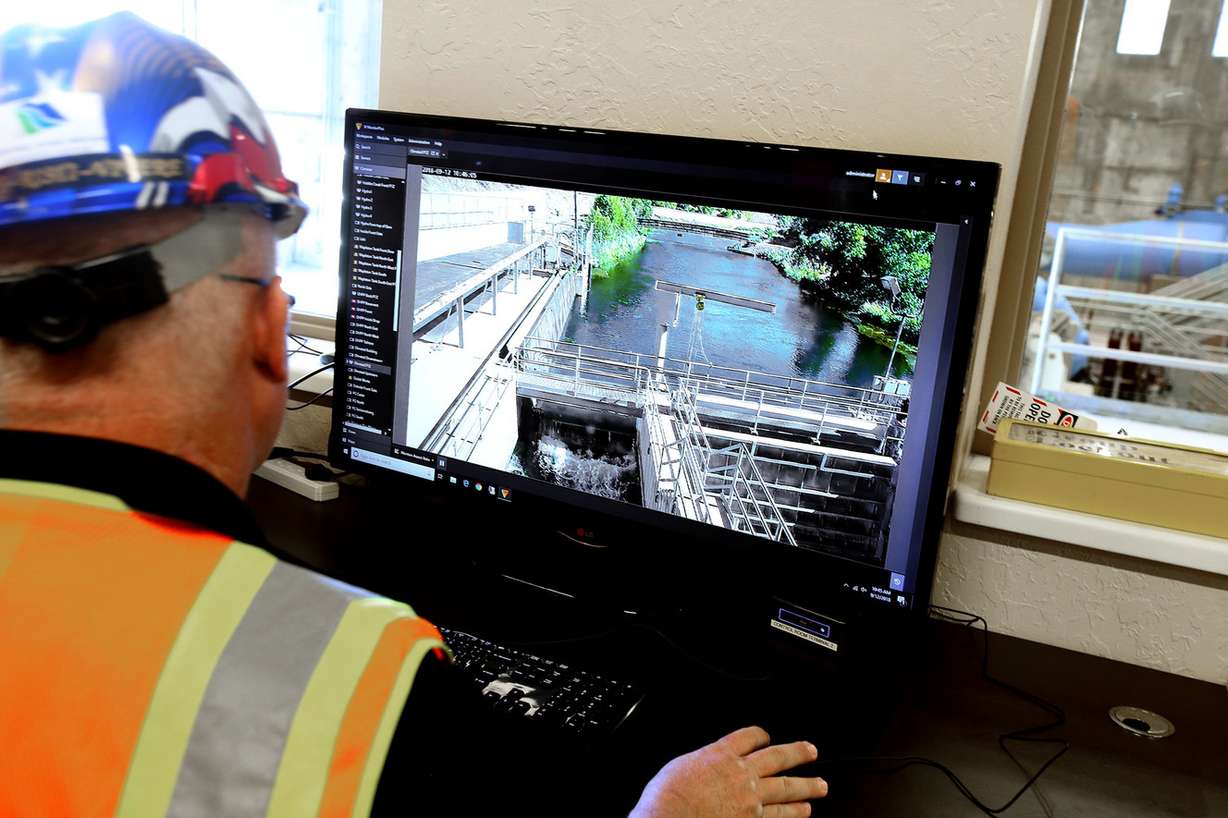 An employee watches video of the intake of the water that supplies the new Olmsted Hydropower plant in Orem on Wednesday, Sept. 12, 2018. (Photo: Laura Seitz, KSL)