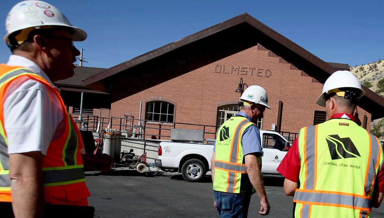 K.C. Shaw, chief Engineer of the Central Utah Water Conservancy District, left, Daryl Devey, Central Utah Project manager, and Richard Tullis, assistant general manager of the Central Utah Water Conservancy District, walk outside the new Olmsted Hydropower plant in Orem on Wednesday, Sept. 12, 2018. (Photo: Laura Seitz, KSL)