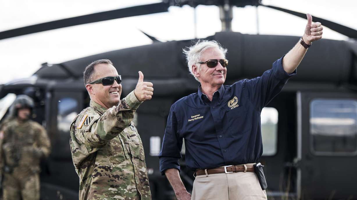 S. Carolina gov spots men on flooded road, summons rescue