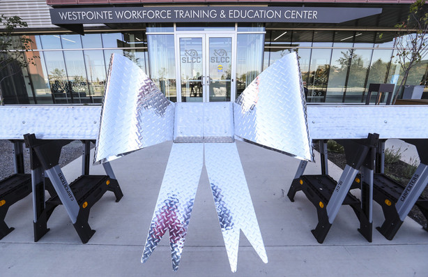 A metal ribbon was created by students for the grand opening of Salt Lake Community College's $43 million, 121,000-square-foot Westpointe Workforce Training and Education Center in Salt Lake City on Wednesday, Sept. 19, 2018. (Photo: Steve Griffin, KSL)