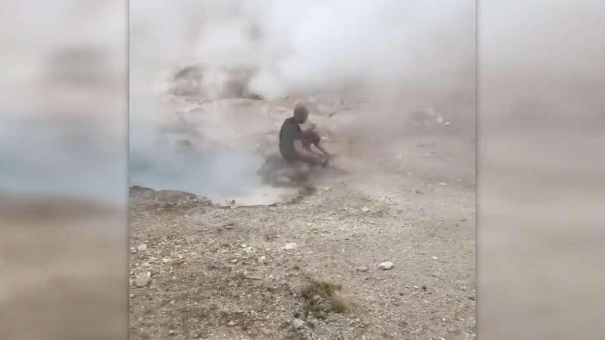 Another video shows man dangerously near Yellowstone spring