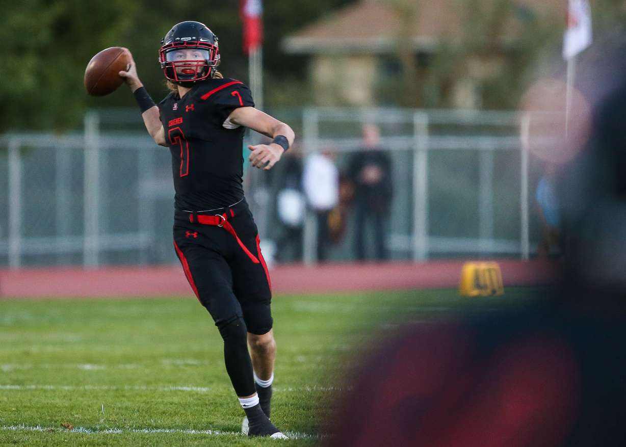 American Fork quarterback Boone Abbott looks downfield as Lone Peak High School takes on American Fork High School in American Fork on Friday, Sept. 21, 2018. (Photo: Qiling Wang, Deseret News)