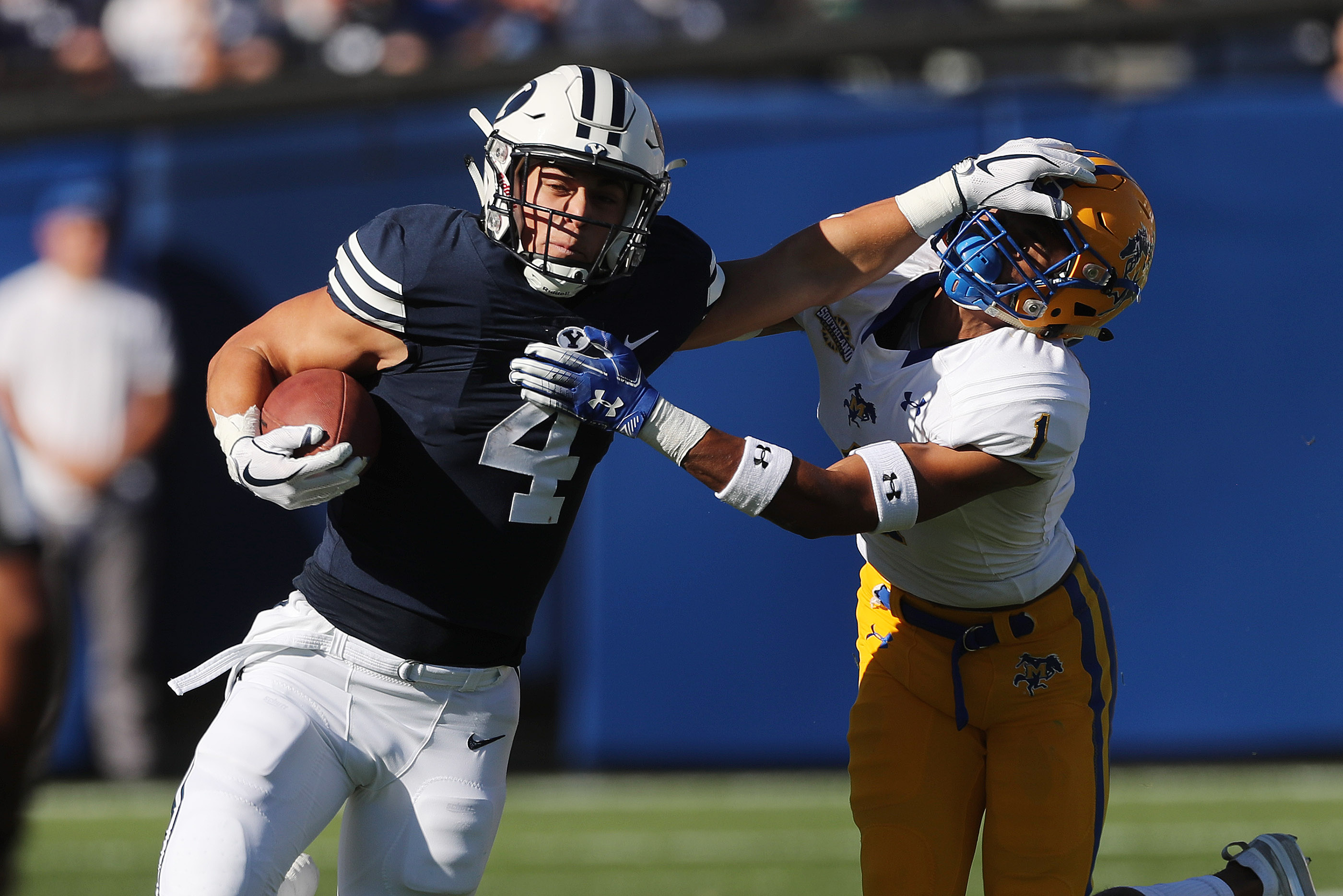 Brigham Young Cougars running back Lopini Katoa (4) runs by McNeese State Cowboys defensive back Darion Dunn (1) in Provo on Saturday, Sept. 22, 2018. (Photo: Jeffrey D. Allred, KSL)