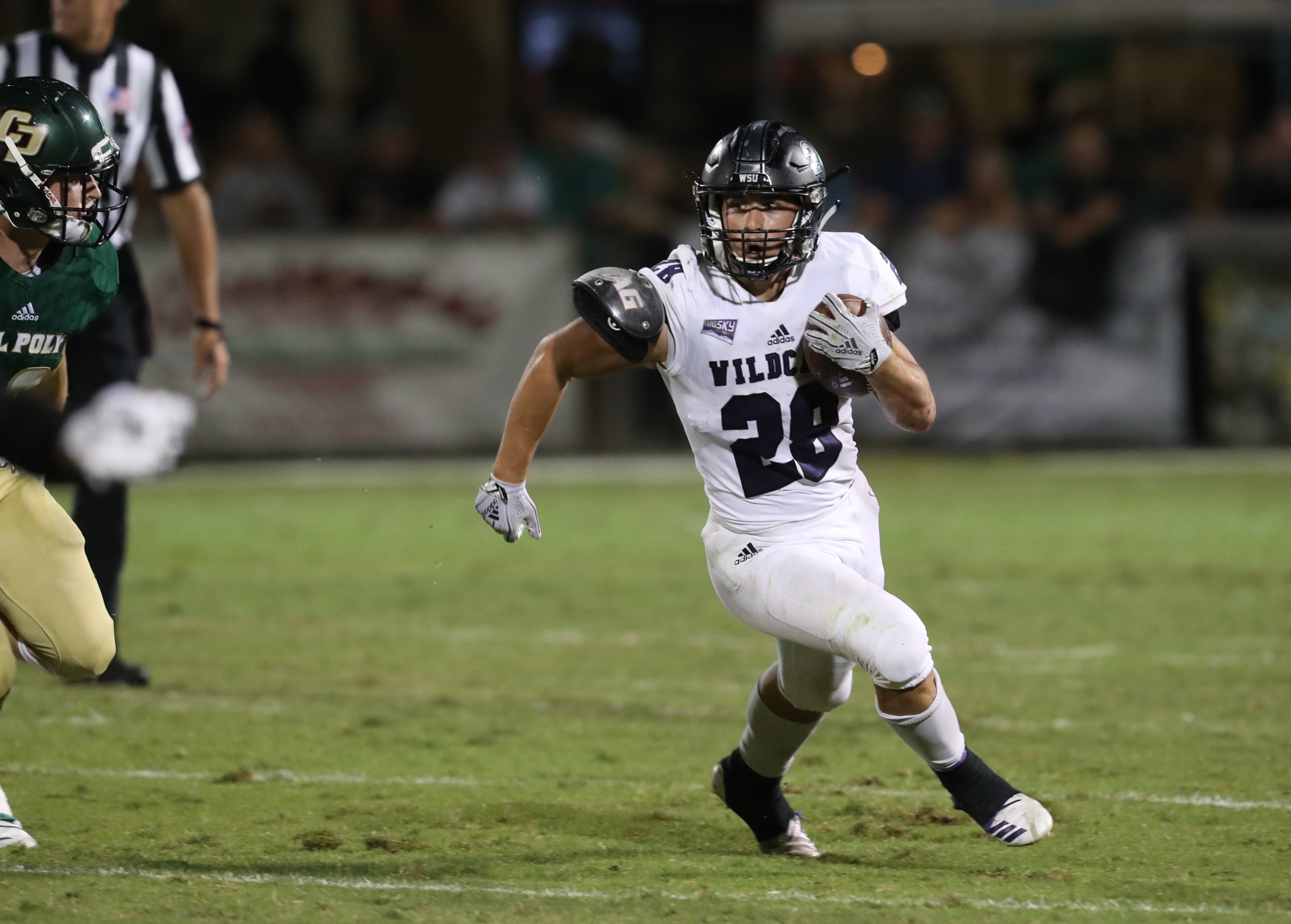Weber State's Josh Davis runs the ball against Cal Poly in a win in San Luis Obispo, Calif. (Photo: Robert Casey, Weber State Athletics)