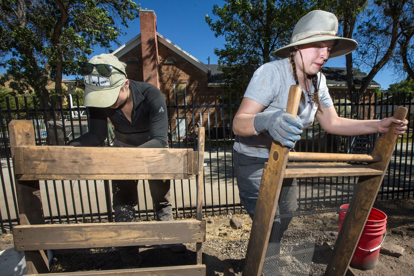 Whitney Seal, left, and Tynisha Lutz screen dirt for artifacts at Fort Douglas Military Museum in Salt Lake City on Saturday, Sept. 22, 2018. The location originally housed a series of barracks inhabited by soldiers from the early 1860s to before World War I. (Photo: Qiling Wang, KSL)