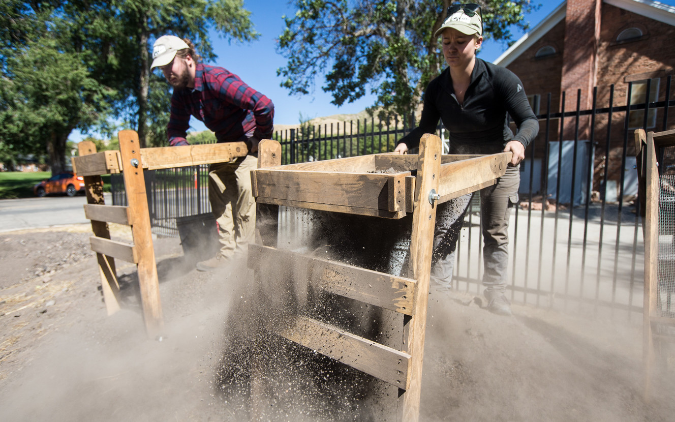 Chase Roberts, left, and Whitney Seal sift out dust from the dirt at Fort Douglas Military Museum in Salt Lake City on Saturday, Sept. 22, 2018. (Photo: Qiling Wang, KSL)