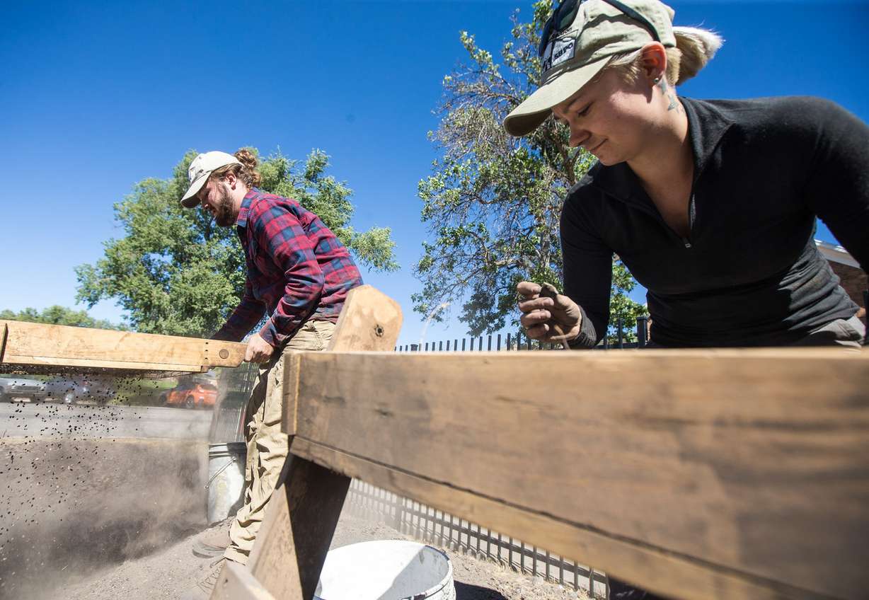 Chase Roberts, left, and Whitney Seal screen dirt for artifacts at Fort Douglas Military Museum in Salt Lake City on Saturday, Sept. 22, 2018. The location originally housed a series of barracks inhabited by soldiers from the early 1860s to before World War I. (Photo: Qiling Wang, KSL)