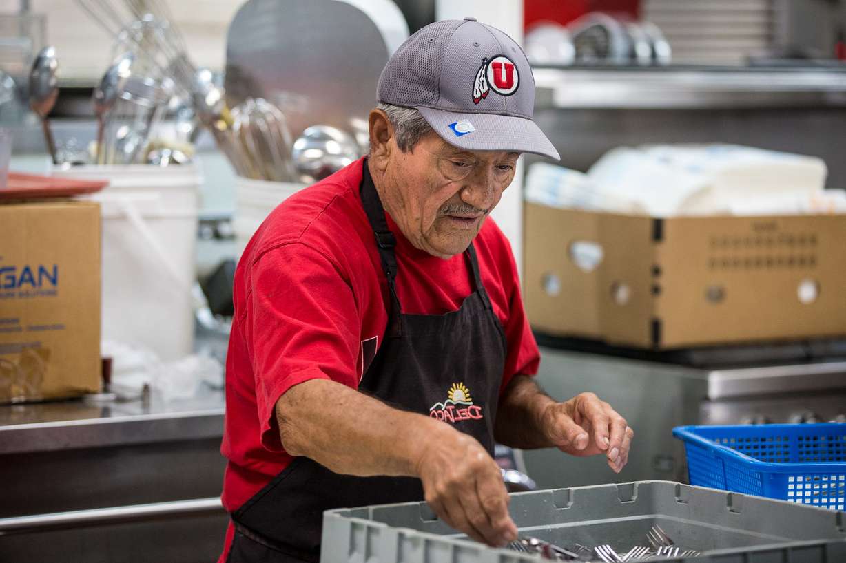 Pablo Montano wraps forks in paper napkins at St. Vincent de Paul Dining Hall in Salt Lake City on Thursday, Sept. 20, 2018. (Photo: Qiling Wang, KSL)