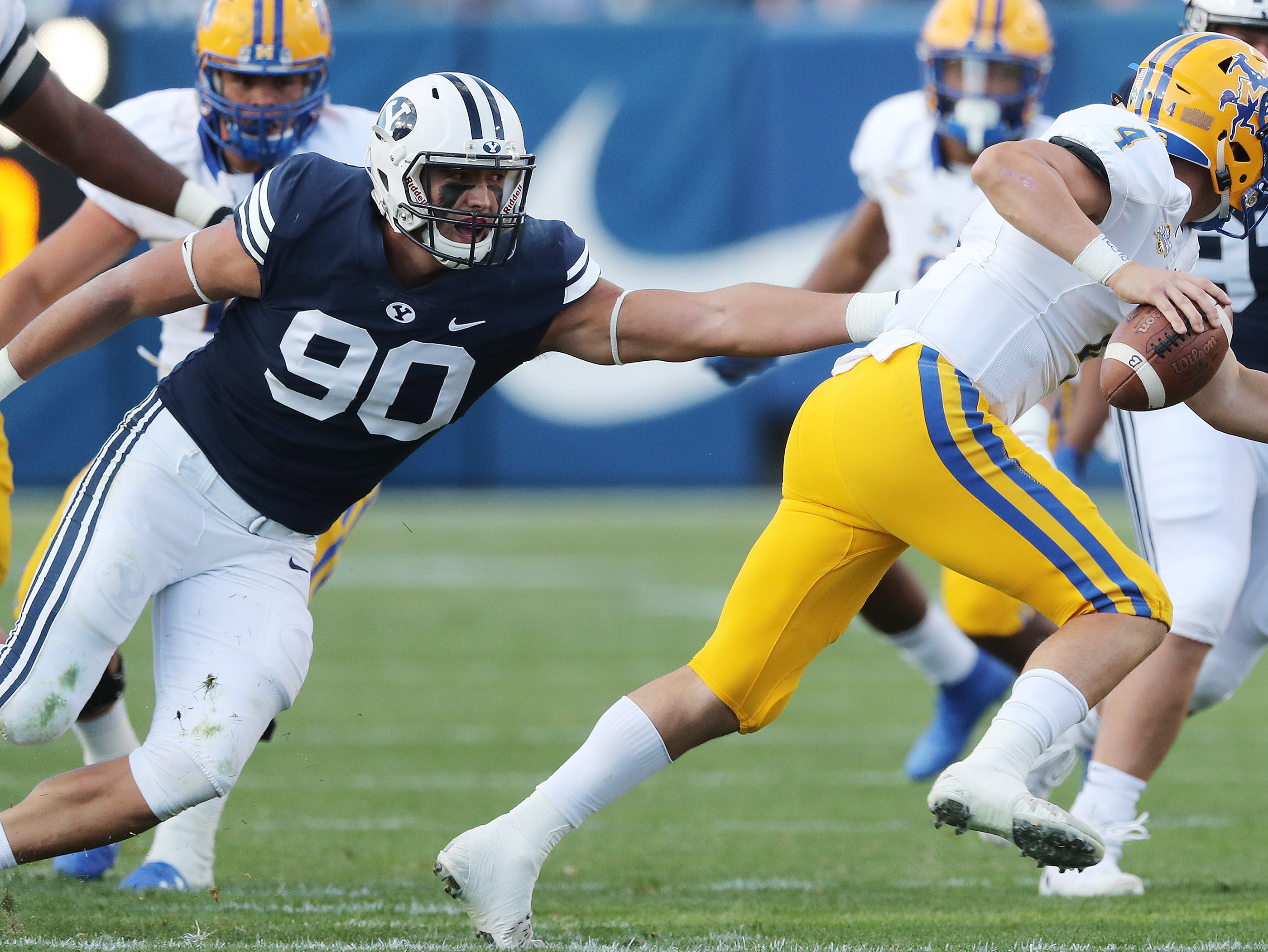 Brigham Young Cougars defensive lineman Corbin Kaufusi (90) hurries McNeese State Cowboys quarterback James Tabary (4) in Provo on Saturday, Sept. 22, 2018. BYU won 30-3. (Photo: Jeffrey D. Allred, Deseret News)
