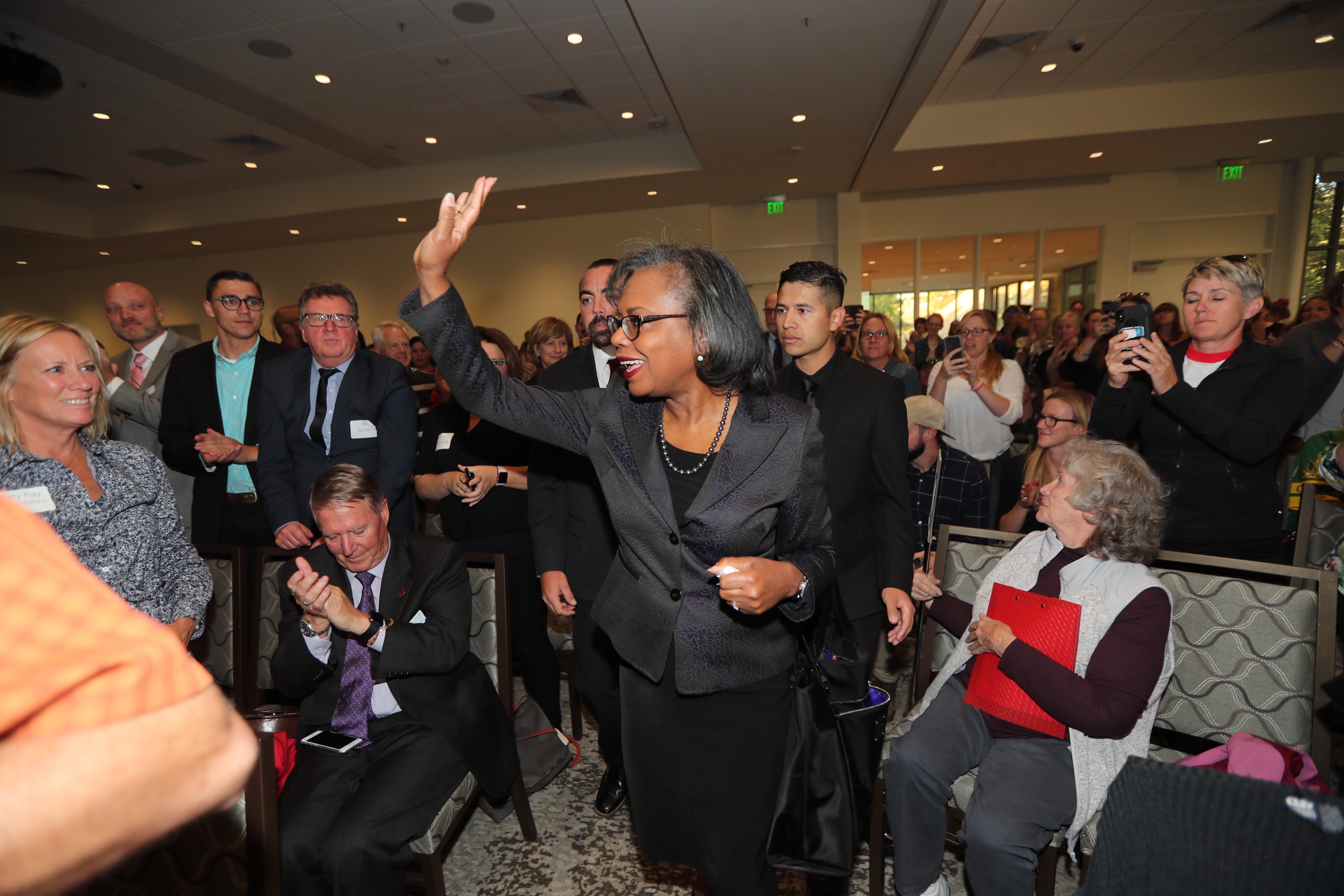 Anita Hill waves to the crowd as she enters the room prior to speaking at the Obert C. and Grace A. Tanner Humanities Center at the University of Utah in Salt Lake City on Wednesday, Sept. 26, 2018. (Photo: Scott G Winterton, KSL)