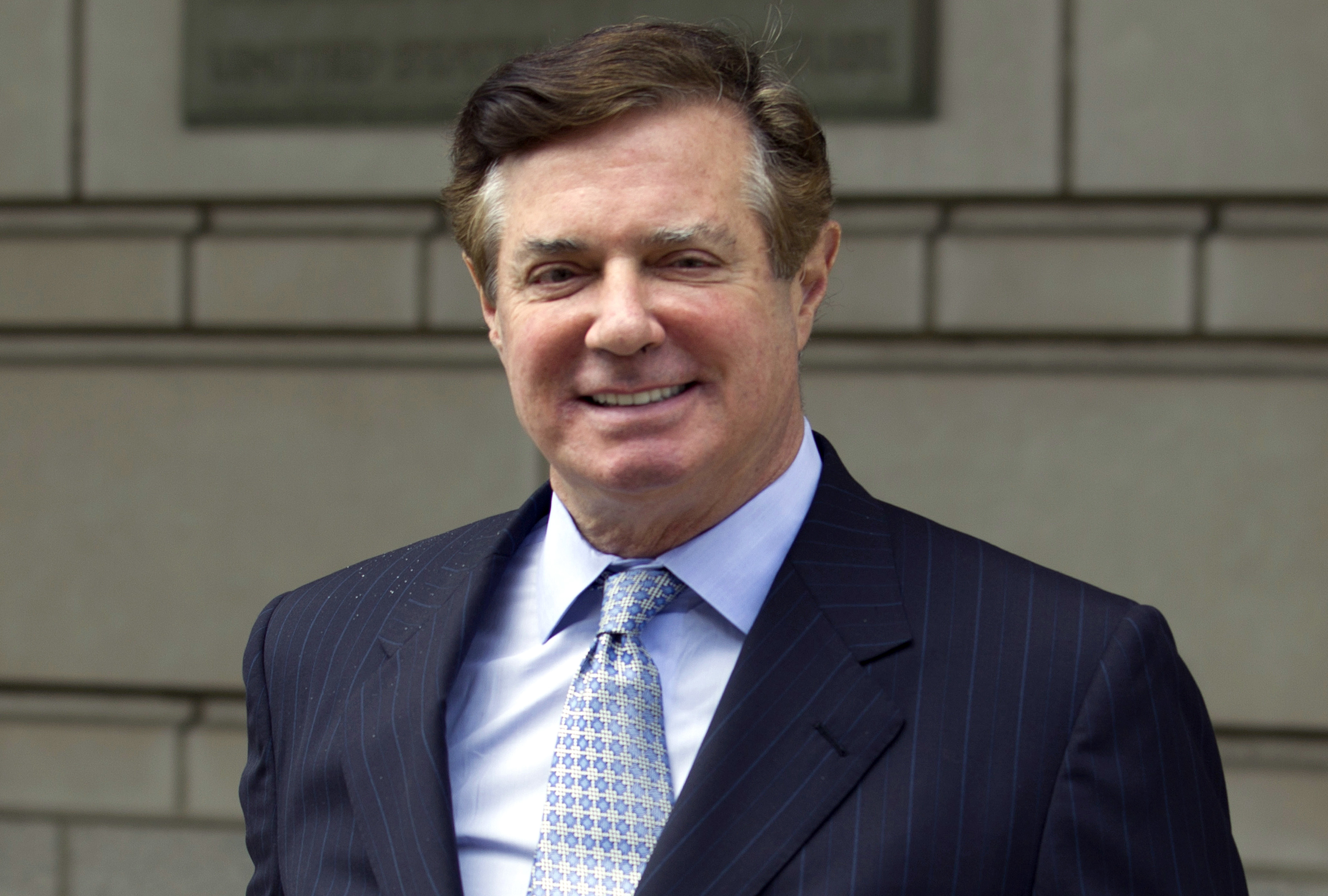 Manafort to be sentenced in February; appears in wheelchair