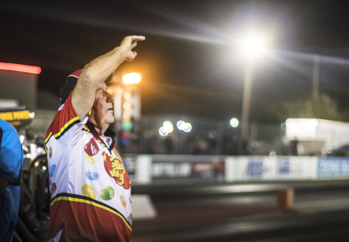 Racer Ed Jones, who operates the Jelly Belly Rocket Powered Stage Coach, waves and sings farewell to a sold-out crowd at Rocky Mountain Raceways on Saturday, Sept. 15, 2018. Rocky Mountain Raceways, which turned 50 this year, is shutting down after one last day of racing on Saturday. (Photo: Carter Williams, KSL.com)