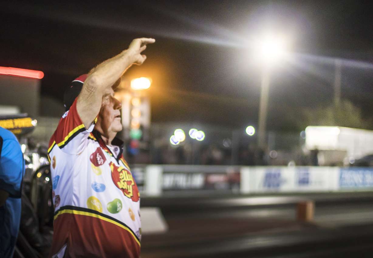 Racer Ed Jones, who operates the Jelly Belly Rocket Powered Stage Coach, waves and sings farewell to a sold-out crowd at Rocky Mountain Raceways on Saturday, Sept. 15, 2018. Rocky Mountain Raceways, which turned 50 this year, is shutting down after one last day of racing on Saturday. (Photo: Carter Williams, KSL.com)