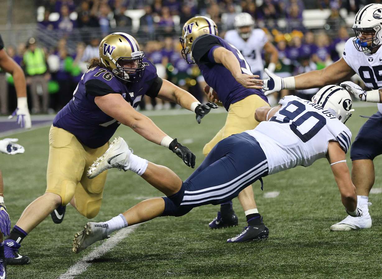 Brigham Young Cougars defensive lineman Corbin Kaufusi (90) is blocked as Washington Huskies quarterback Jake Browning (3) scores in Seattle on Saturday, Sept. 29, 2018. (Photo: Jeffrey D. Allred, Deseret News)
