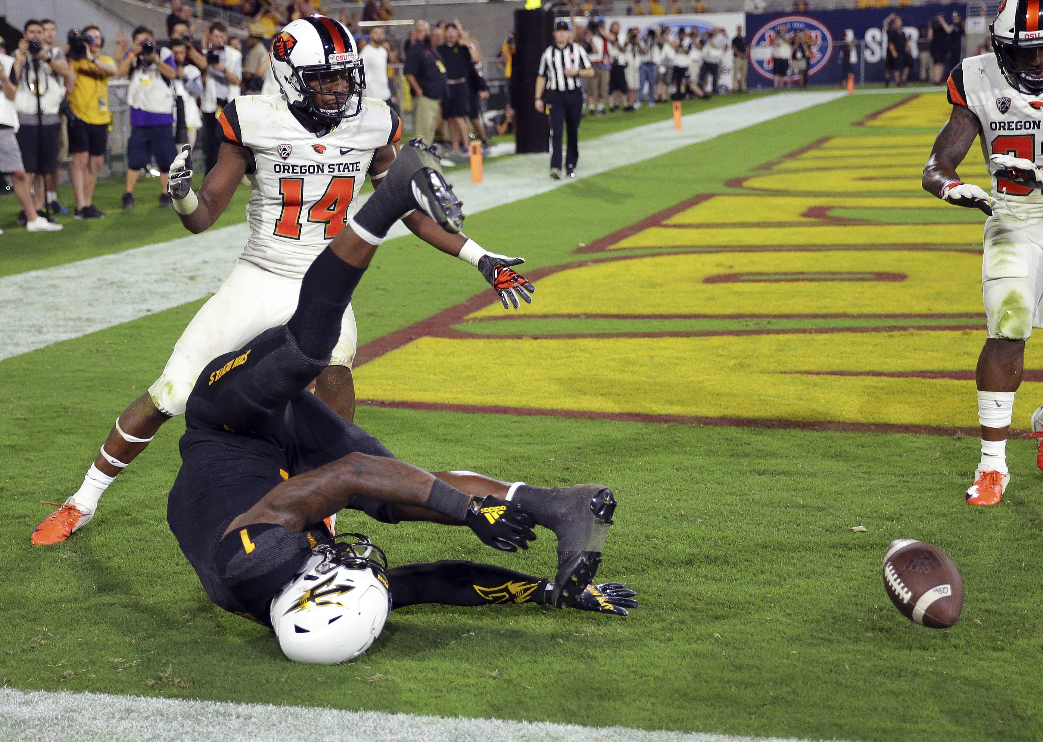 Arizona State's N'Keal Harry lunges for a catch in the end zone while being defended by Oregon State's Kaleb Hayes (14) during a game, Sept. 29, 2018 in Tempe, Arizona.