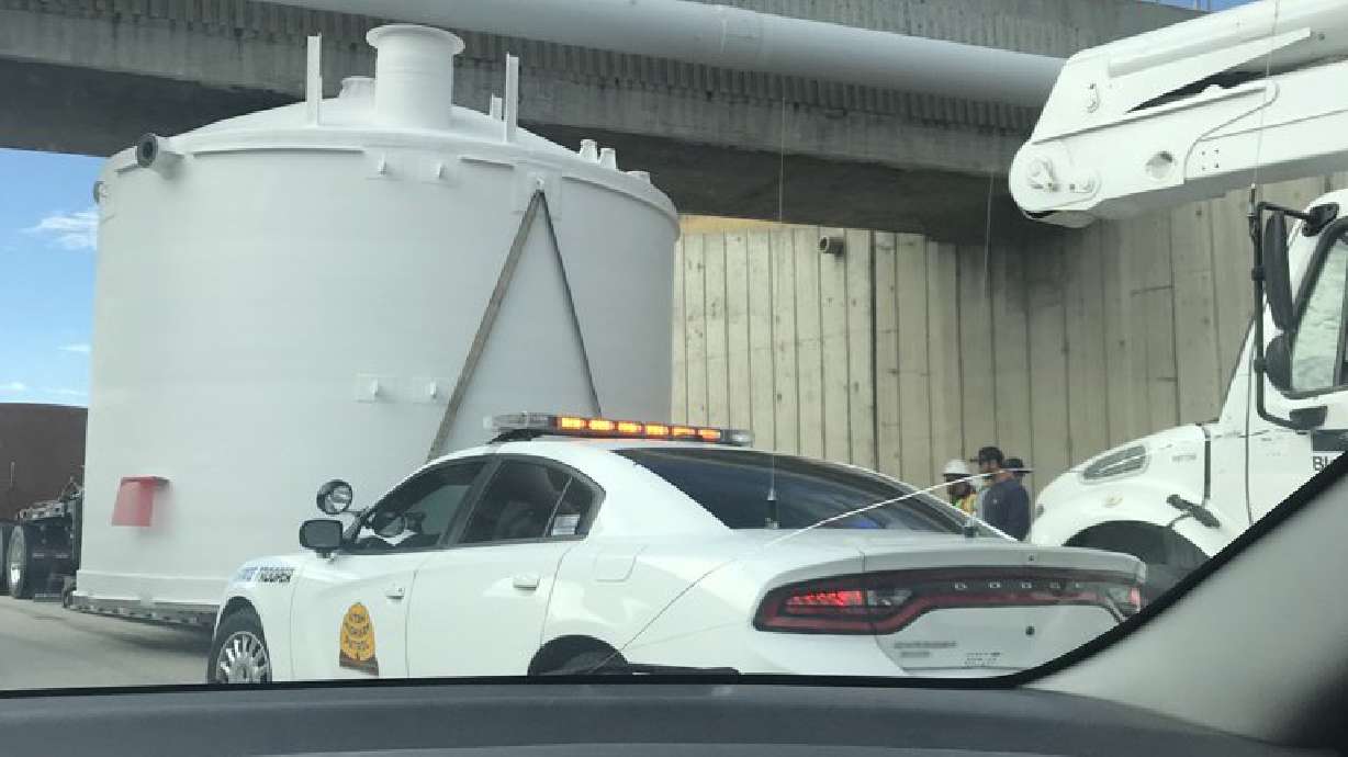 Truck stuck underneath highway in West Jordan extricated 2 hours later