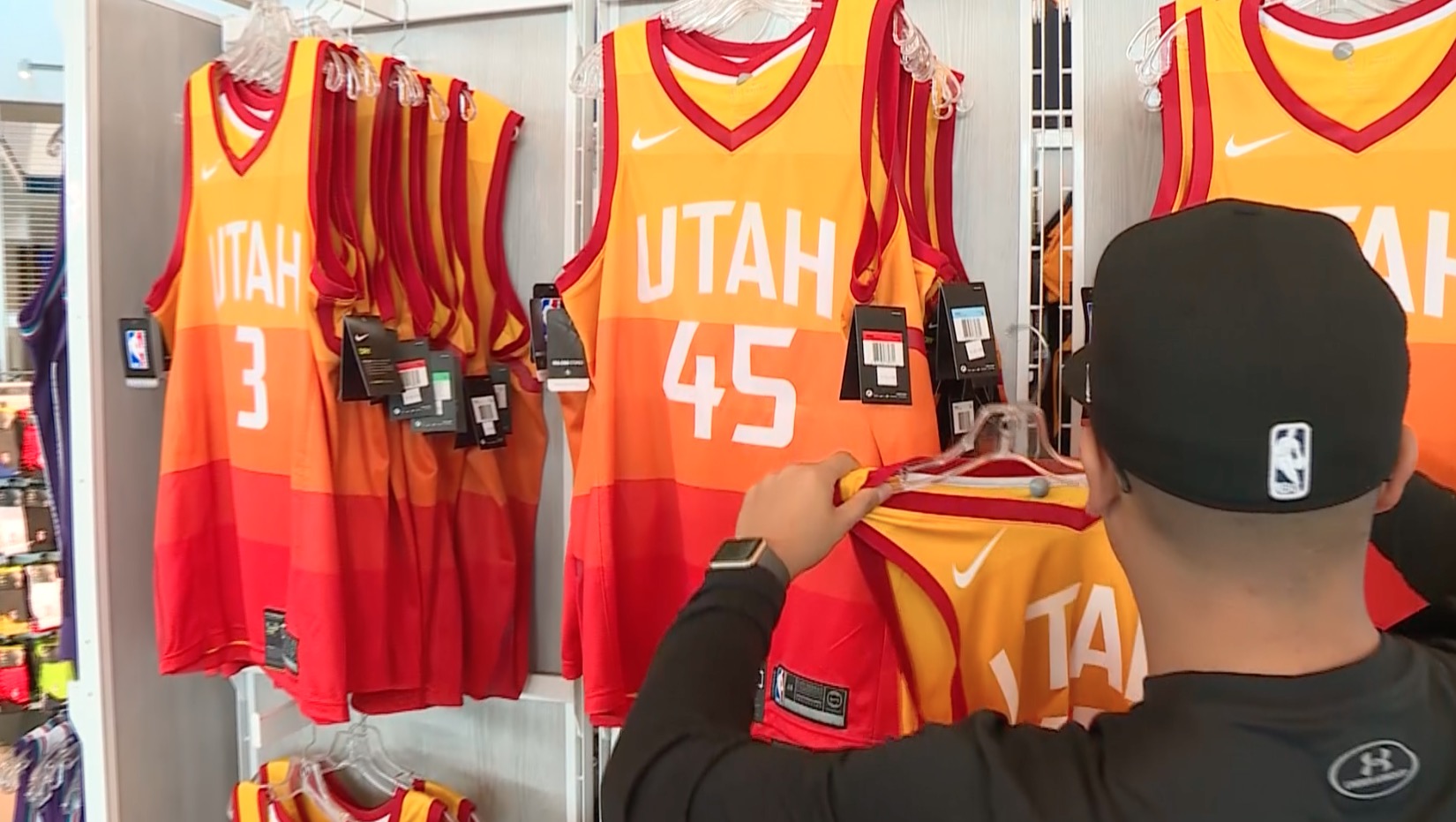 A Utah Jazz Store employee puts a Jazz "City Edition" jersey on a rack on Tuesday, Jan. 23, 2018. (Photo: John Wilson, KSL TV)